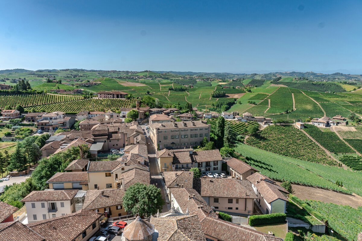 Piemonte, Italy. Town with rolling hills and vineyards surround it.